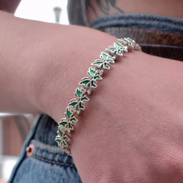 Bracelets, lady's wrist with a silver Butterfly bracelet