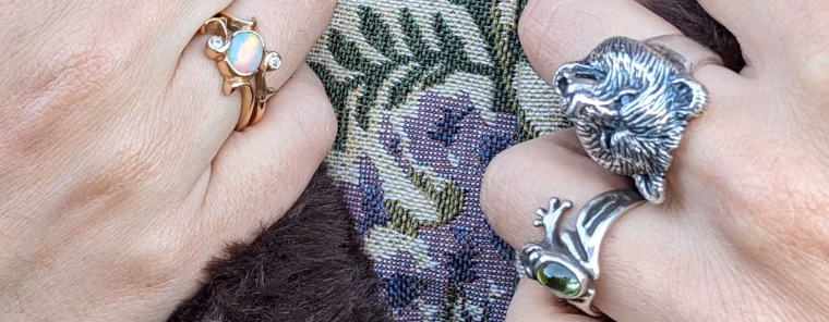 Animal rings, silver Frog and Bear ring over a lady's warm coat