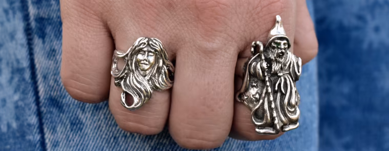 Character rings, silver Lady with flowing hair and Wizard rings worn on a lady's hand