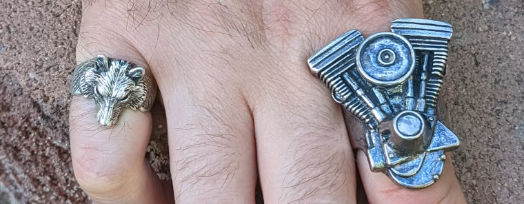 Riding rings, large silver Evolution engine ring on a man's hand
